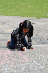 GIrl with sidewalk chalk